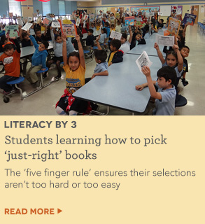 Students learning how to pick 'just-right' books as part of Literacy By 3