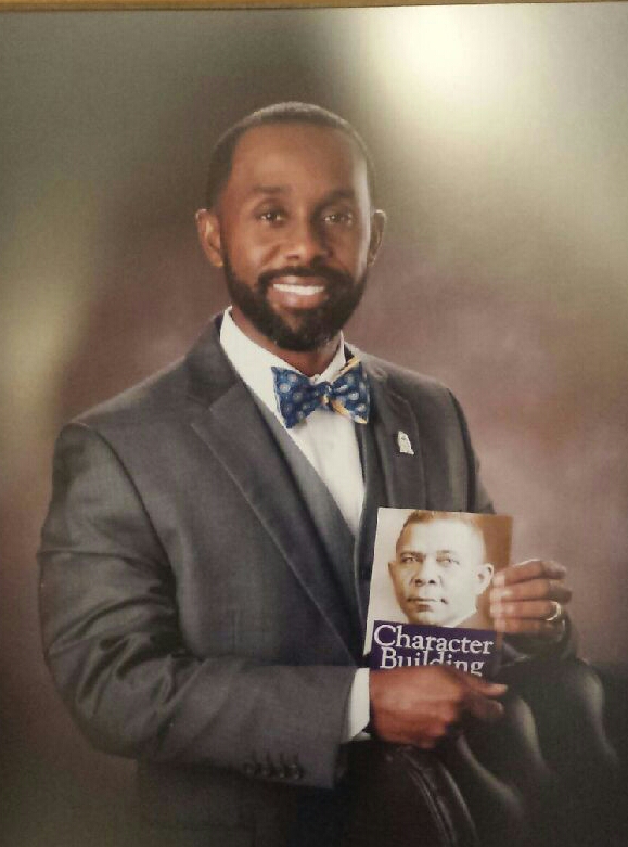 Dr. Carlos Phillips II, Principal 