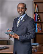 Carlos Phillips II Principal 