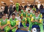Karate students sitting in the stands 