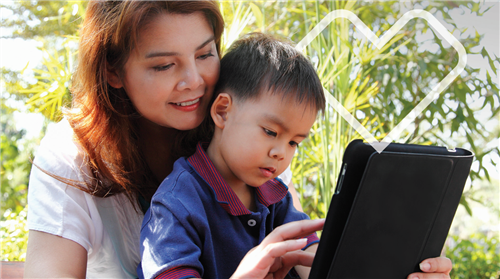 woman and child viewing ipad