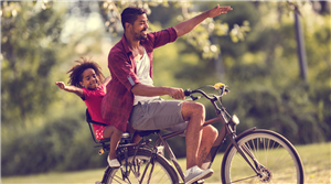 dad and son in bicycle 