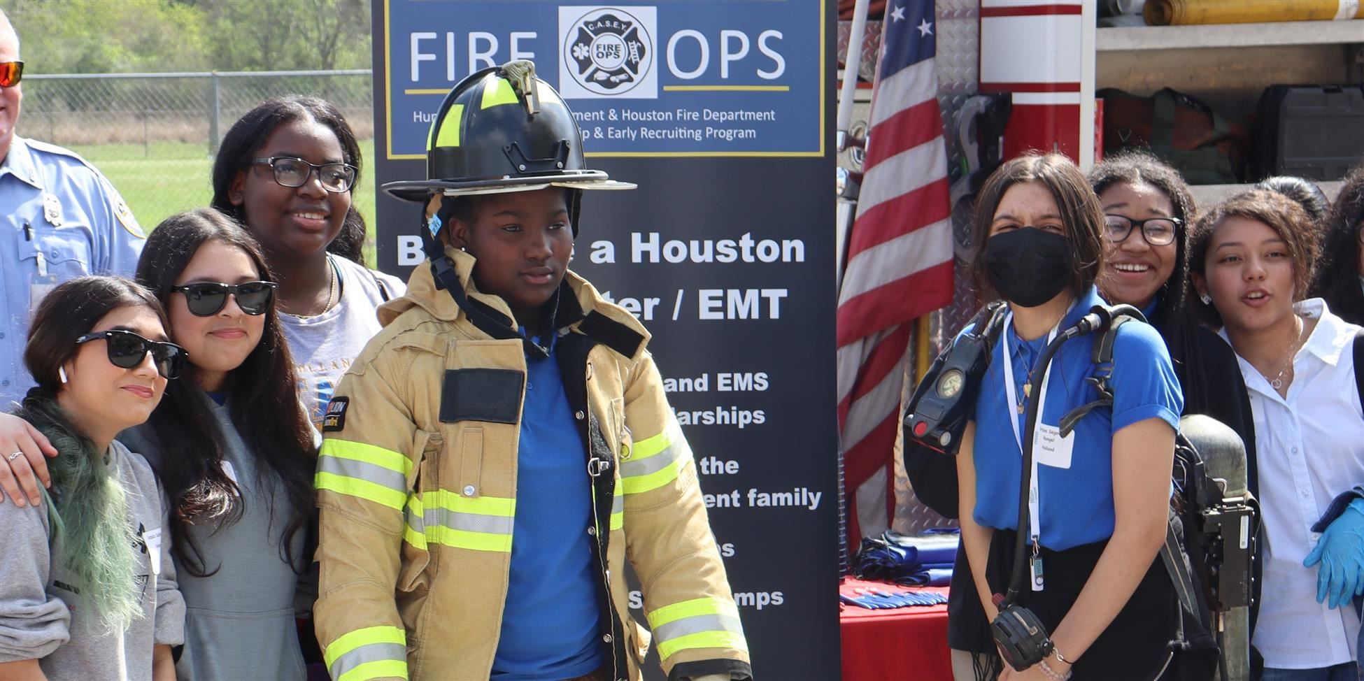  Girls pose for a photo outside a firetruck