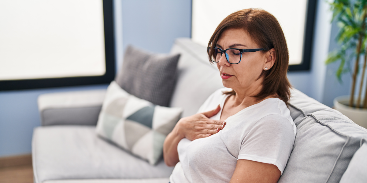 woman sitting with a panic attack