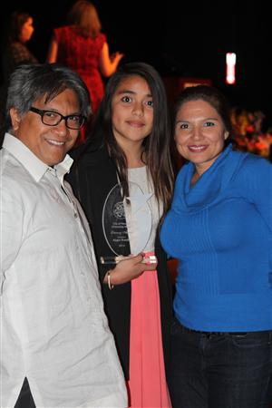 Angie Bonilla and her First Place plaque at the Asia Society Center, with Principal Ms. Moreno and teacher Mr. Severino. Angie Bonilla and her First Place plaque at the Asia Society Center, with Principal Ms. Moreno and teacher Mr. Severino.