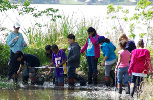 Fifth-grade teacher Amy Blonn works with a group of students at Lake Livingston in Trinity, Texas. Fifth-grade teacher Amy Blonn works with a group of students at Lake Livingston in Trinity, Texas.