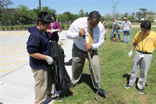 Mr. Monsivais planting a tree.